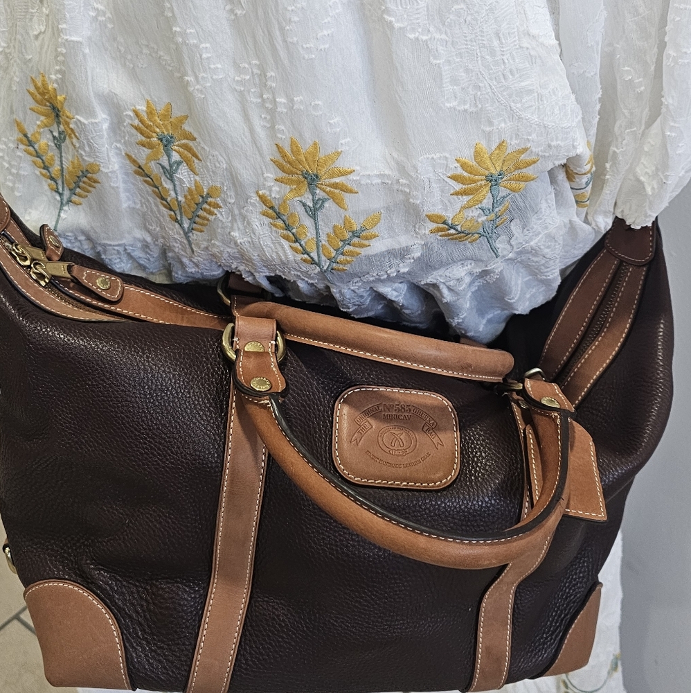 Brown ghurka minicav bag with pouch, leather shoulder strap.